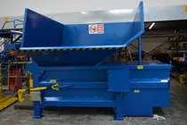 A fully Refurbished static compactor with a fork lift tipper hopper